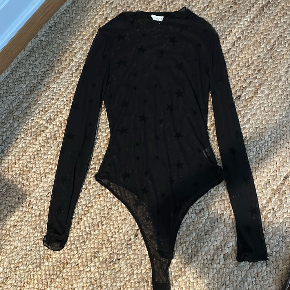 See through black starred body suite. Size large.
